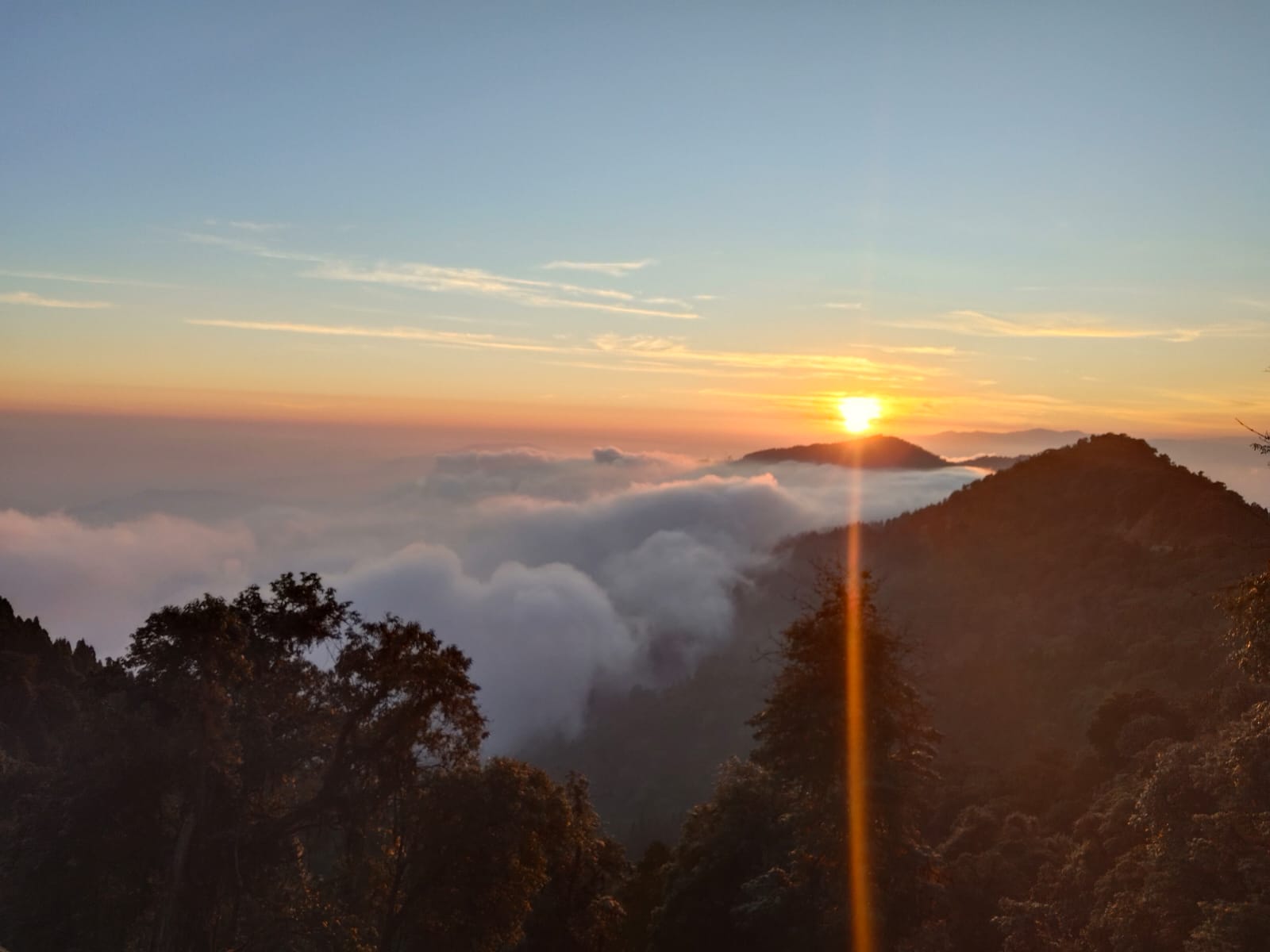 Sunrise above a sea of clouds